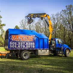 Newton Tree Service knuckleboom crane.